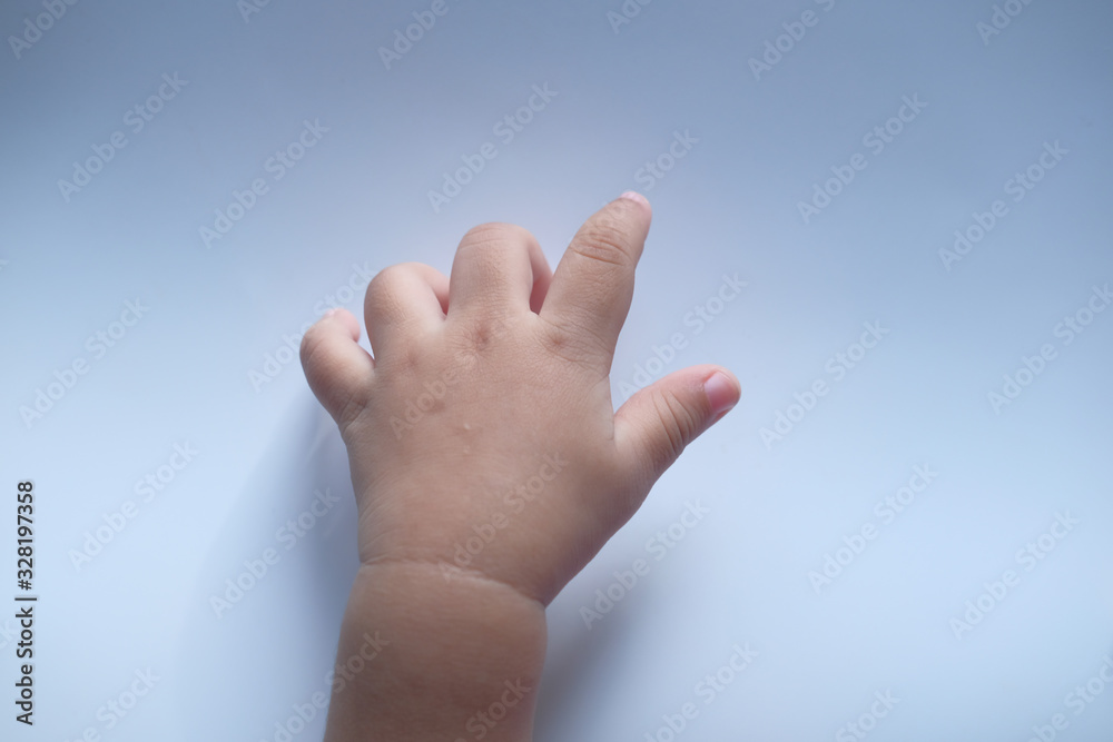 Close up of baby hand on white background Close up of baby hand on white background