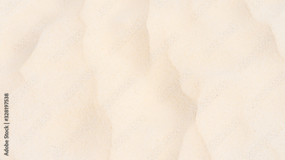 Naklejka premium Closeup shot of sand texture on the beach as background
