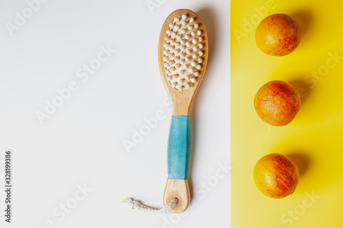Anti-cellulite massage brush on a white background. Orange peel cellulite concept. Lymphatic drainage massage. Place for text. organic cactus brush © Ekaterina