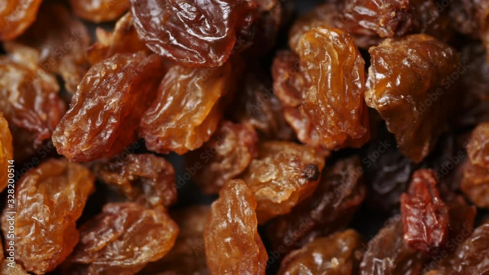 Sweet dried golden brown raisins in extreme close up macro Sweet dried golden brown raisins in extreme close up macro
