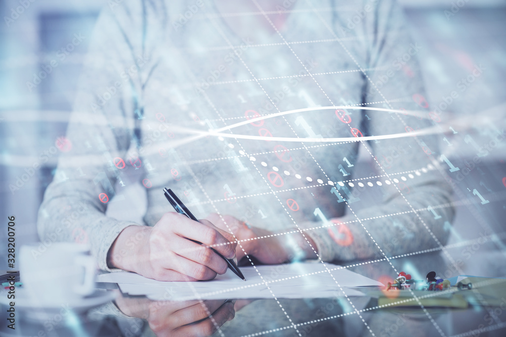 Hand taking notes in notepad. Forex chart holograms in front. Concept of research. Double exposure Hand taking notes in notepad. Forex chart holograms in front. Concept of research. Double exposure