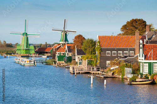 Wooden windmills in Zaanse Schans village, countryside near Amsterdam