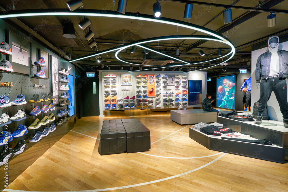 HONG KONG, CHINA - CIRCA JANUARY, 2019: interior shot of a Foot Locker store  in Hong Kong. Foot Locker Retail, Inc. is an American sportswear and footwear  retailer. Photos | Adobe Stock