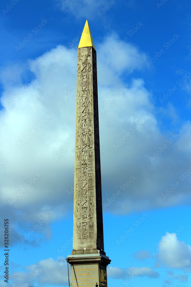  The monument is an Egyptian obelisk high with a gilded tip and hieroglyphs written on it. It is located in the center of the capital.