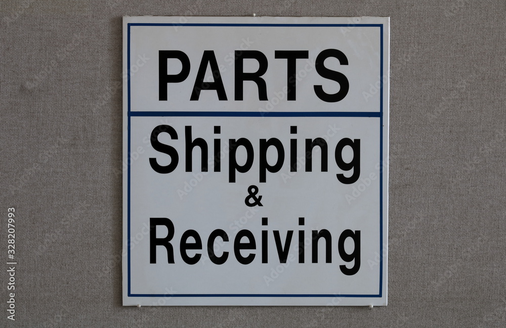 Fototapeta premium Sign indicating parts department and shipping & receiving