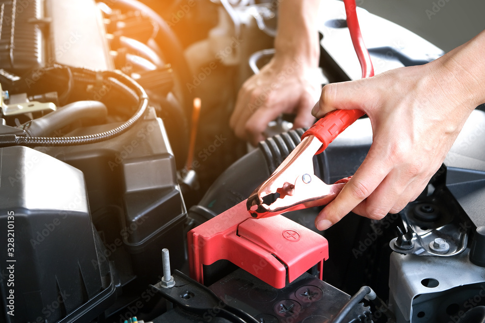 Car maintenance technician He is checking the auto engine, car inspection center. Car maintenance technician He is checking the auto engine, car inspection center.