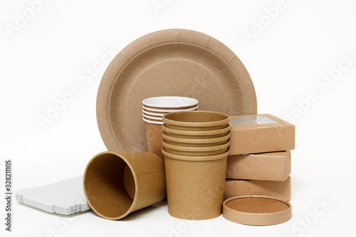 Eco kraft paper tableware. Paper cups, dishes, fast food containers, paper napkins isolated on white background. Recycling concept. Zero waste.