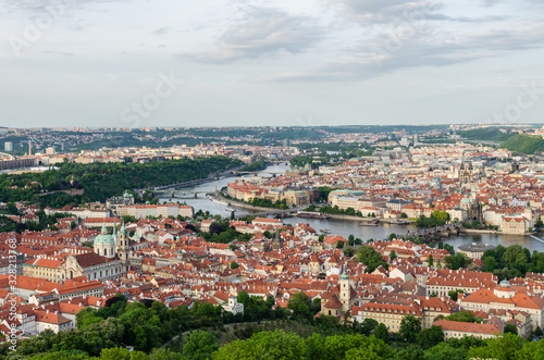 Orange color roof houses with Charles bridge in the background in Prague Czech Republic © ujjwal