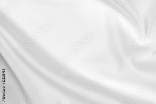 Abstract white fabric texture background. Cloth soft wave. Creases of satin, silk, and cotton. © Ekkachai