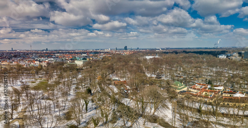 Panoramic winter aerial, snowy munich at the Englischer Garten with the Chinese Turm.
