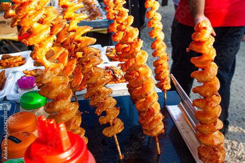 Spiral fried popatoes - fast food on the Langkawi night market photo