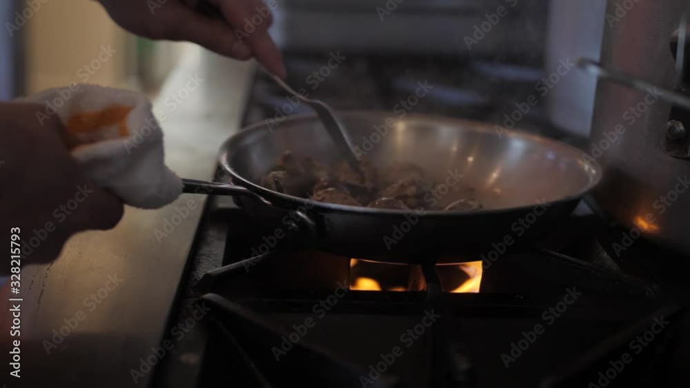 Gourmet Chef Cooks Oysters in Sauce Over Flaming Grill, 4k slow motion Gourmet Chef Cooks Oysters in Sauce Over Flaming Grill, 4k slow motion