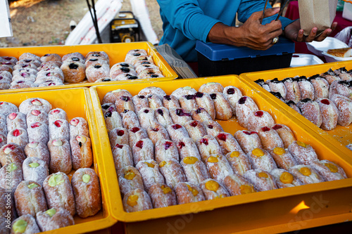 Fresh sugar donuts assortmant in night market in Malaysia photo