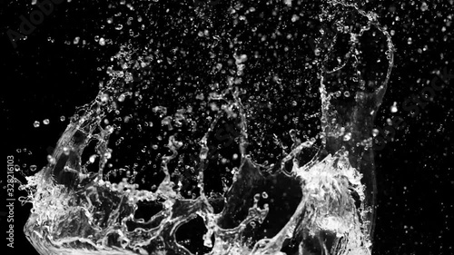 Slow motion of water splash abstract particle on black background