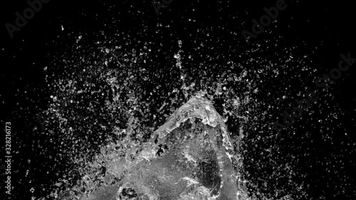 Slow motion of water splash abstract particle on black background