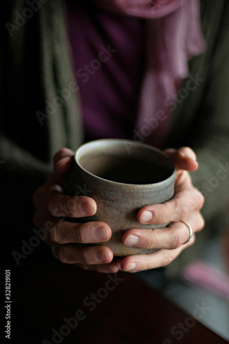 Coffee mug in hands