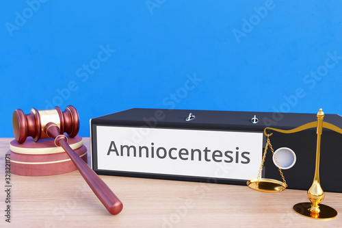 Amniocentesis – File Folder with labeling, gavel and libra – law, judgement, lawyer