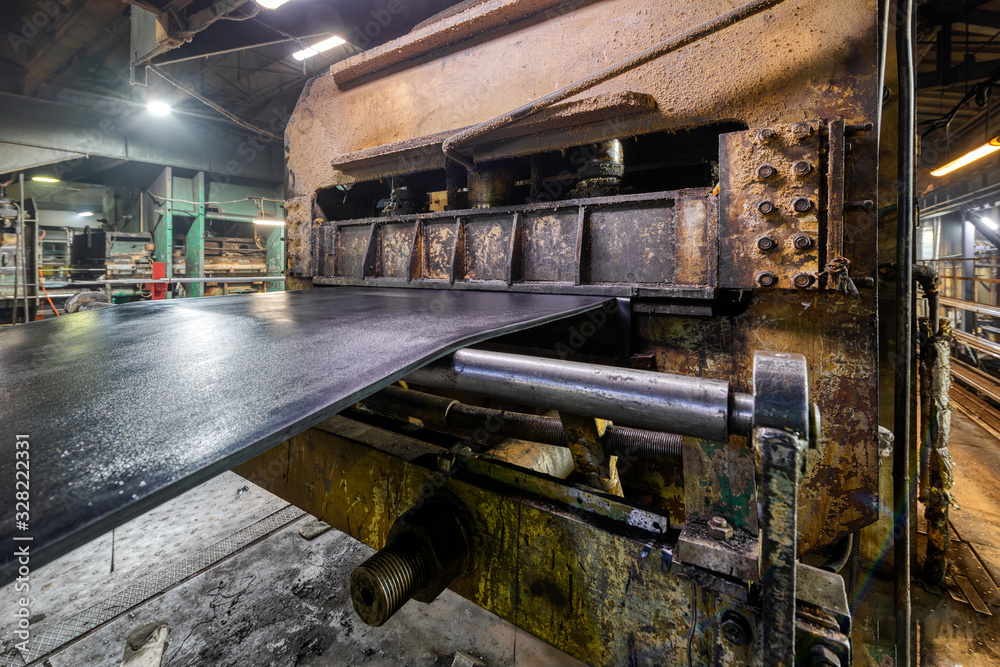 Large press for vulcanizing rubber bands.