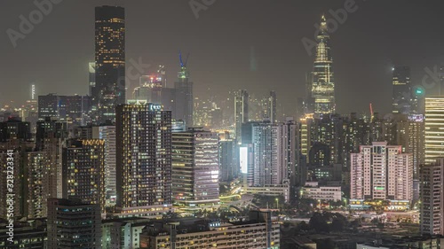 Wallpaper Mural Night time lapse of downtown Shenzhen. Day to night transition timelapse of busy crowded cbd of major Chinese city. Nightfall in bustling metropolis. Modern life in major financial center. Torontodigital.ca