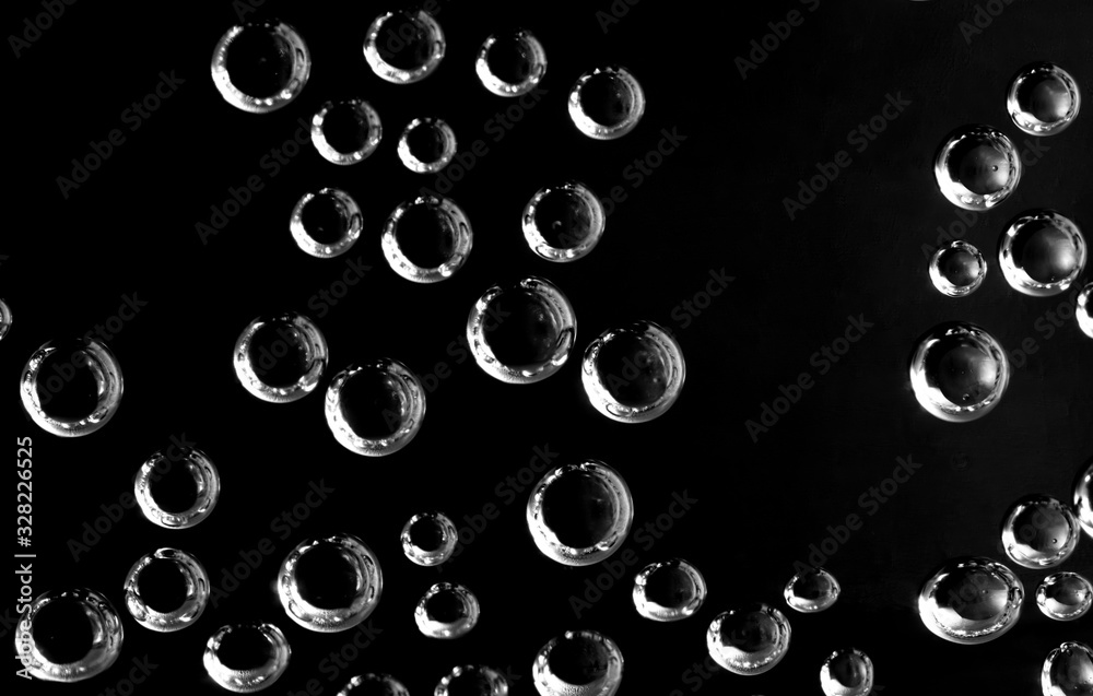 Air balls in water on a black background Air balls in water on a black background