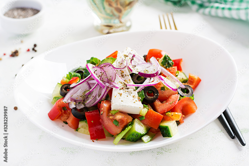 Trendy salad. Greek salad  with fresh vegetables, feta cheese and black olives.  Healthy balanced eating.