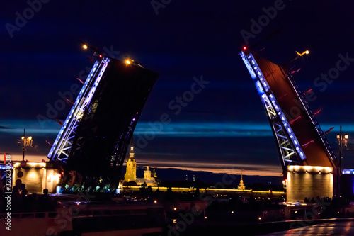 Opening of Palace drawbridge. Night view of Palace bridge from the Neva river in Saint Petersburg, Russia