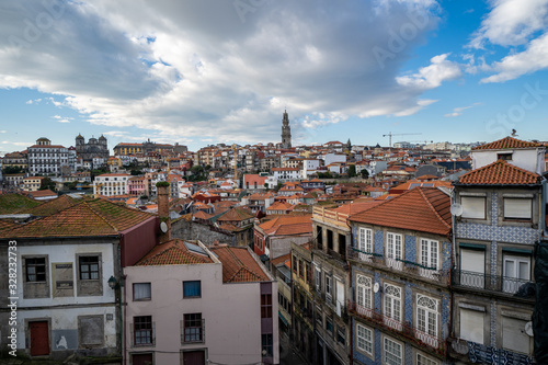 Porto, Portugal - Viewpoint of the red clay rooftops and tower of the Clerigos Church (Baroque style church with bell tower) in Porto Portugal