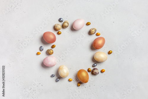 Easter composition made of gold eggs and sweets