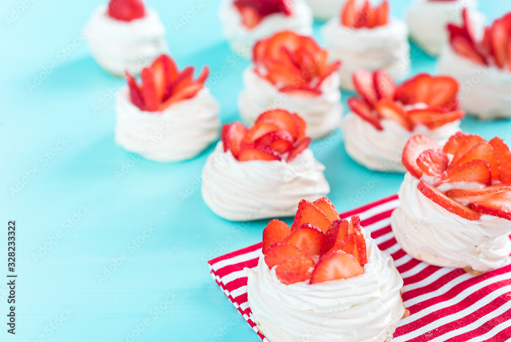 strawberry pavlova topped with fresh cream and strawberries strawberry pavlova topped with fresh cream and strawberries