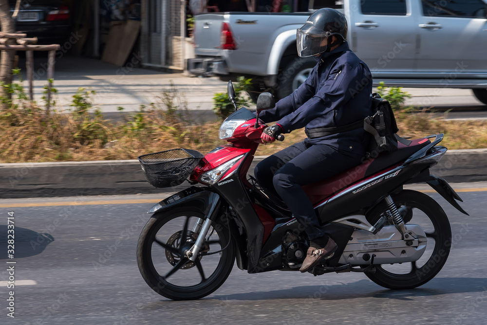 Bangkok, Thailand - March, 04, 2020 : Motion Blurred panning photo of Unidentified name people riding motorcycle in the day time on road at Bangkok, Thailand