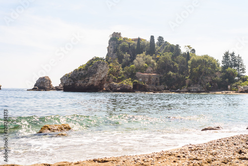 view of Isola bella, a small island near Taormina, Sicily photo