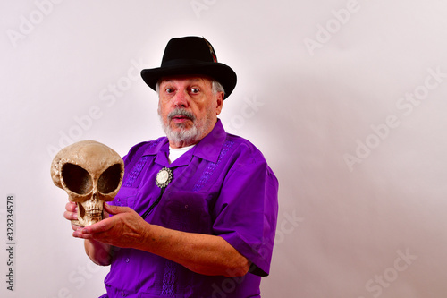 Elderly gentleman showing off his alien skull