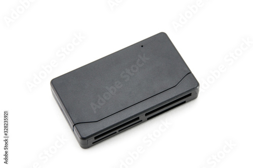 The adapter, the card reader is rectangular, black for all types of flash cards and storage devices. For transferring data from CF, mini cd, micro cd, ms duo media. On a white isolated background