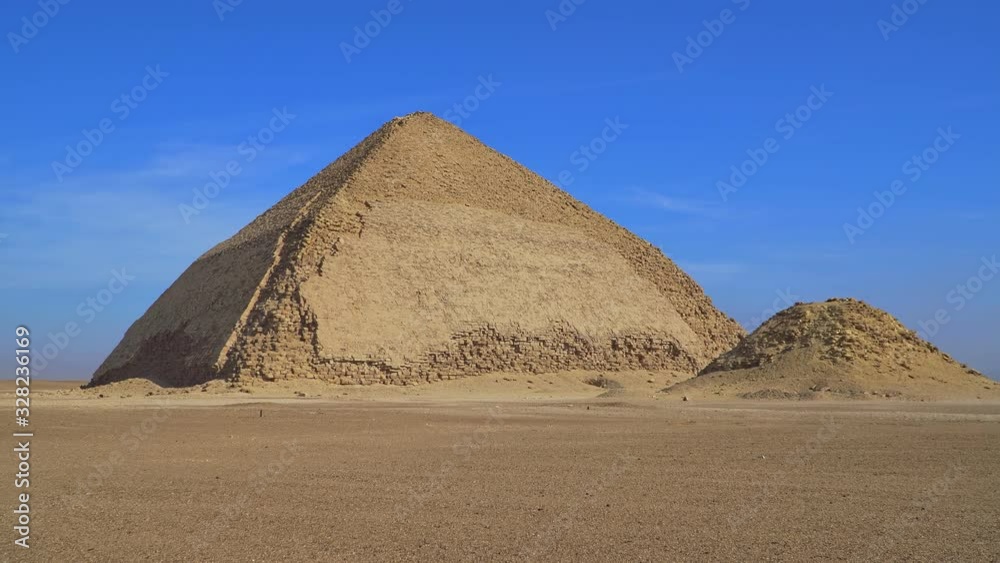 The Bent Pyramid is an ancient Egyptian pyramid located at the royal necropolis of Dahshur, approximately 40 kilometres south of Cairo, built under the Old Kingdom Pharaoh Sneferu. Egypt The Bent Pyramid is an ancient Egyptian pyramid located at the royal necropolis of Dahshur, approximately 40 kilometres south of Cairo, built under the Old Kingdom Pharaoh Sneferu. Egypt