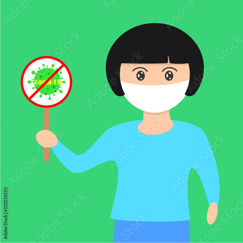 Girl in blue long sleeved shirt holding corona virus, covid-19 sign.