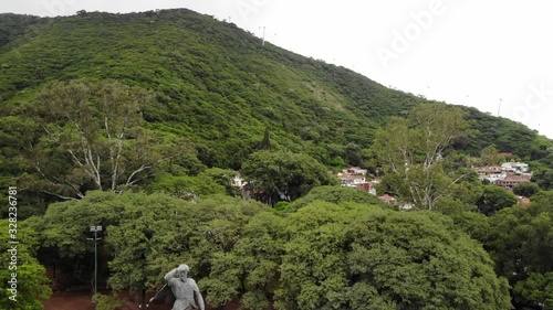 Aerial view of General Martín Miguel de Güemes monument in Salta, Argentina. Drone slowly descending.