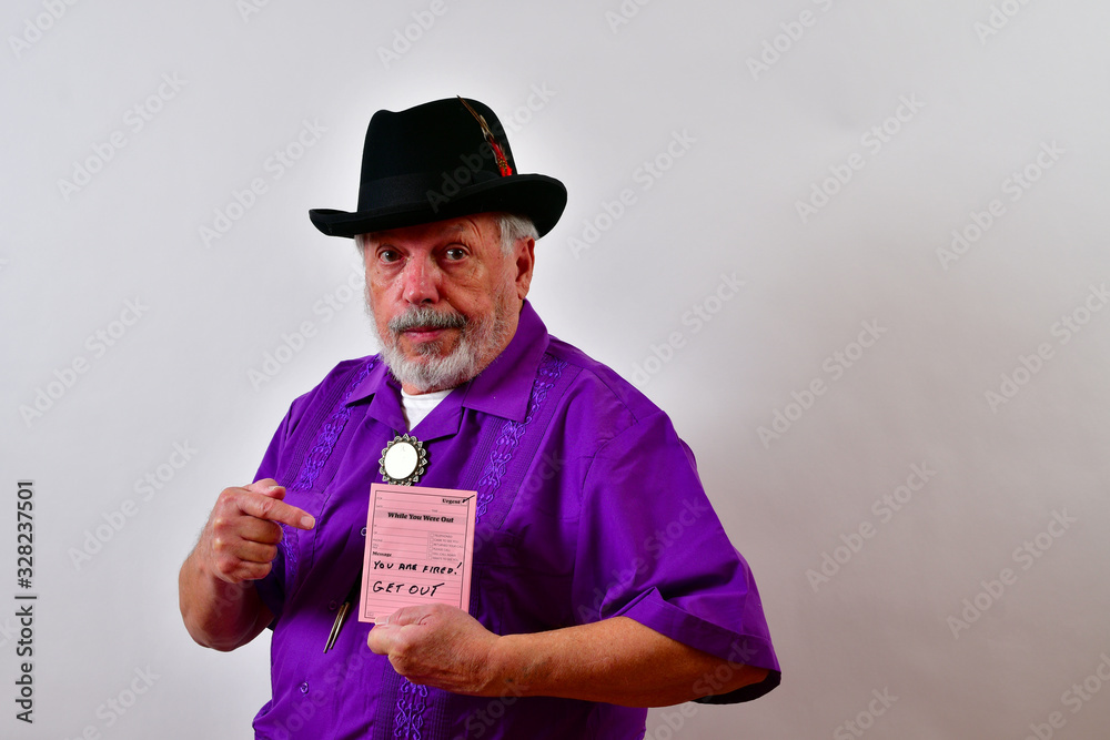 Sharp dressed gentleman is showing an employee the termination memo.
