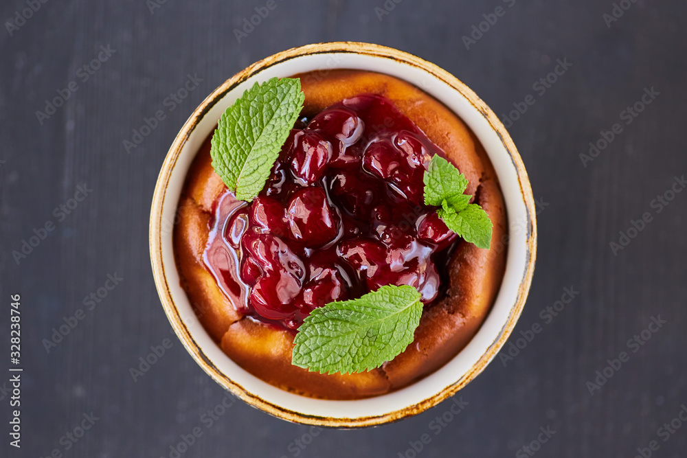 Tender soft dessert in a bun with berries, jam and mint. Tender soft dessert in a bun with berries, jam and mint.