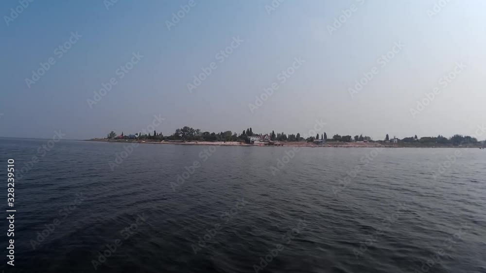 Peninsula against the blue sky and sea water Peninsula against the blue sky and sea water