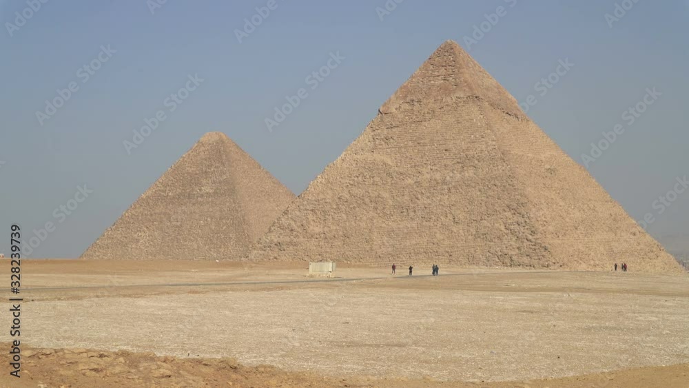 Panoramic view of Egyptian Pyramids located on the Giza Plateau in Cairo, Egypt Panoramic view of Egyptian Pyramids located on the Giza Plateau in Cairo, Egypt