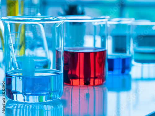 Colorful liquid red, blue, yellow in the glass beakers at the laboratory. for researchers to do work