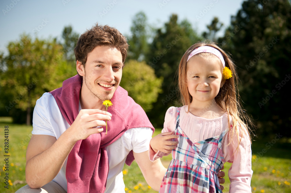 Happy family. Father with daughter on a meadow. Happy family. Father with daughter on a meadow.