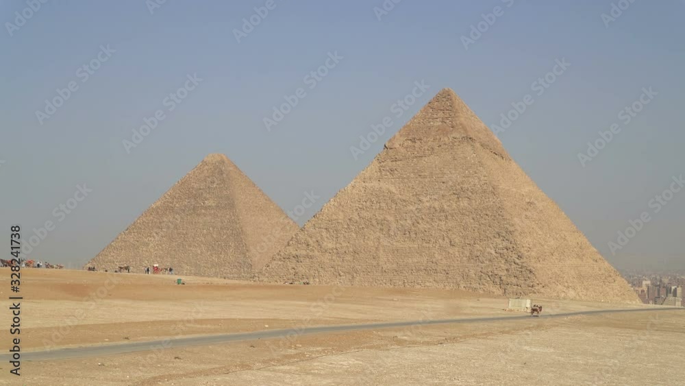 Pyramids of Egypt situated on the Giza plateau in Cairo. Desert landscape, panoramic view Pyramids of Egypt situated on the Giza plateau in Cairo. Desert landscape, panoramic view