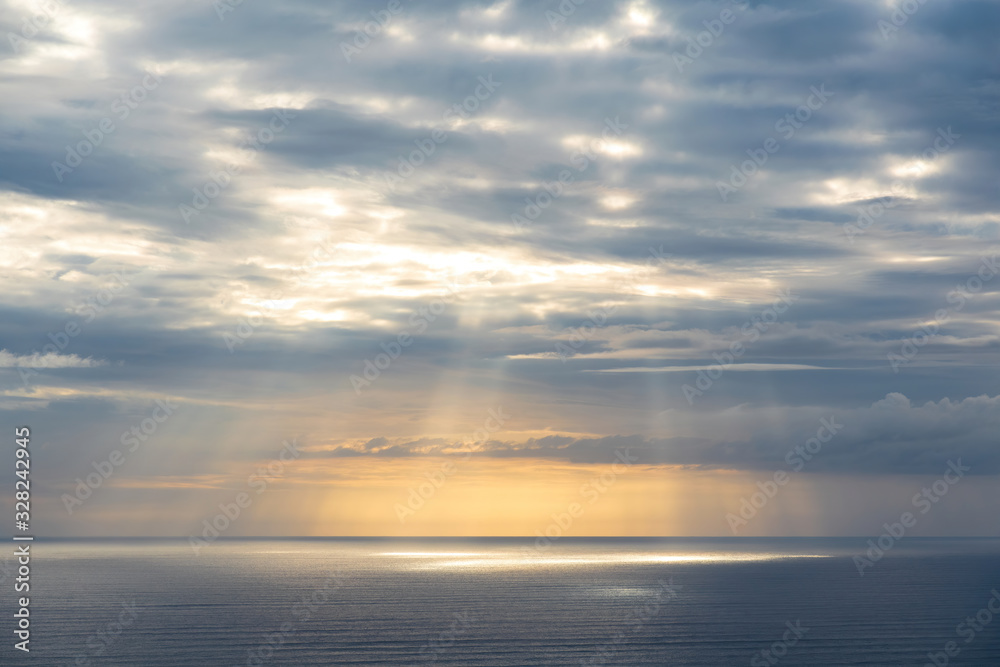 Aerial view of gray evening clouds over Tasman sea coast at Piha beach with run rays Aerial view of gray evening clouds over Tasman sea coast at Piha beach with run rays