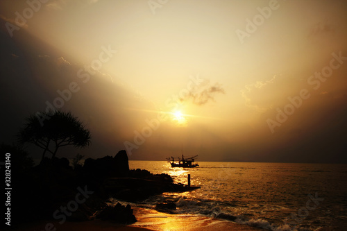 Sunset on the sea and a boat sailed.