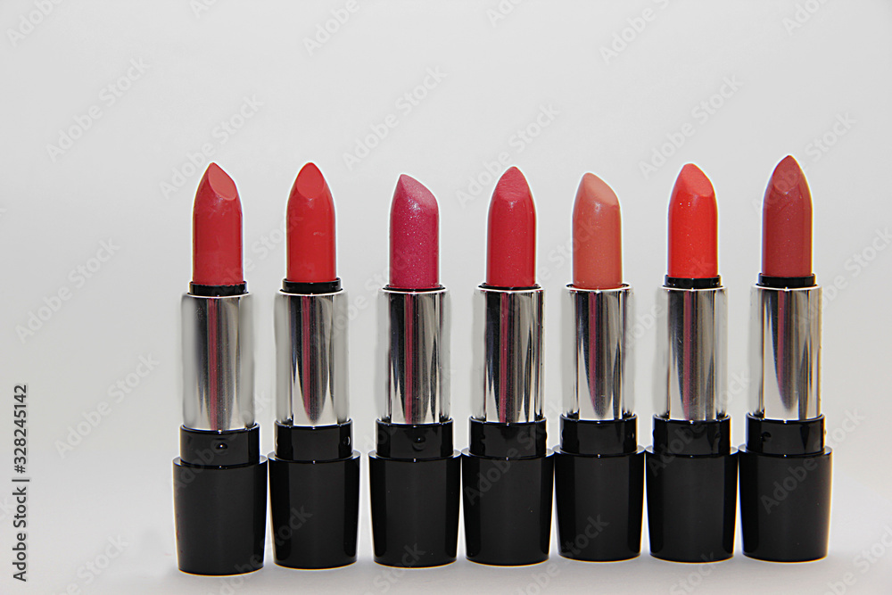 Obraz premium a set of lipsticks of bright colors stand in a row close-up