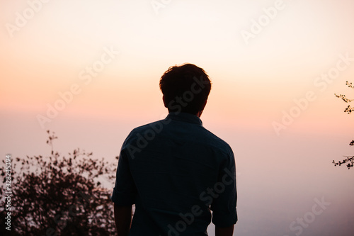 Silhouette of a man during sunset at Sunset Point in Mount Abu, Rajasthan, India