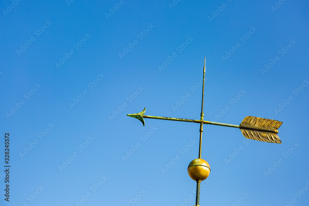 Ancient weather vane on the roof of the church in Strasbourg France Ancient weather vane on the roof of the church in Strasbourg France