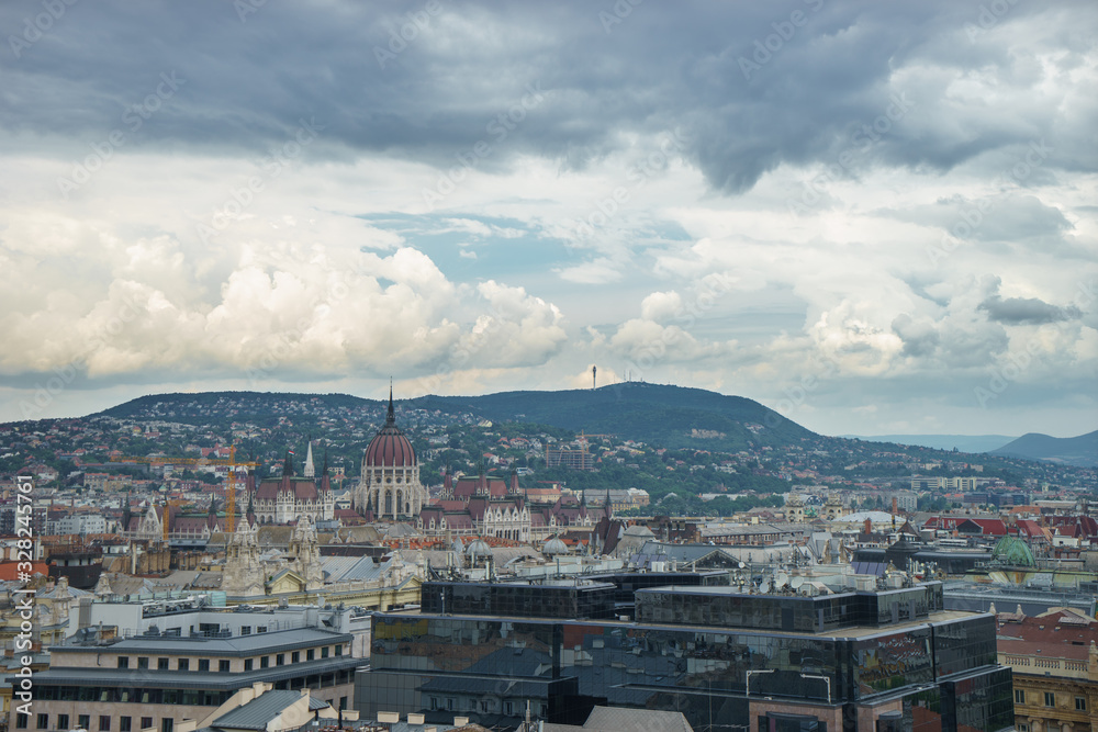 Budapest birds eye view with green hills and rain clouds
