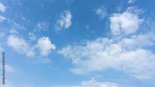 Fototapeta Naklejka Na Ścianę i Meble -  Beautiful white fluffy clouds on vivid blue sky in a sunny day
